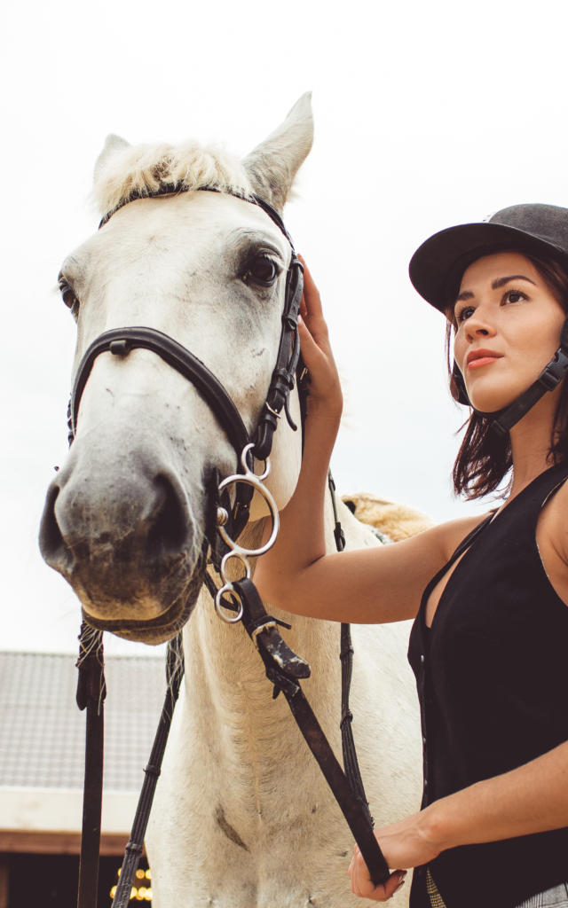 girls learn how to ride horses