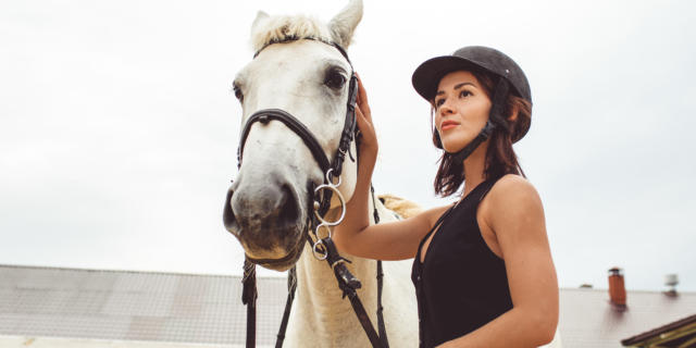 girls learn how to ride horses