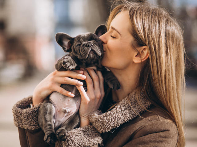 Woaman with french bulldog